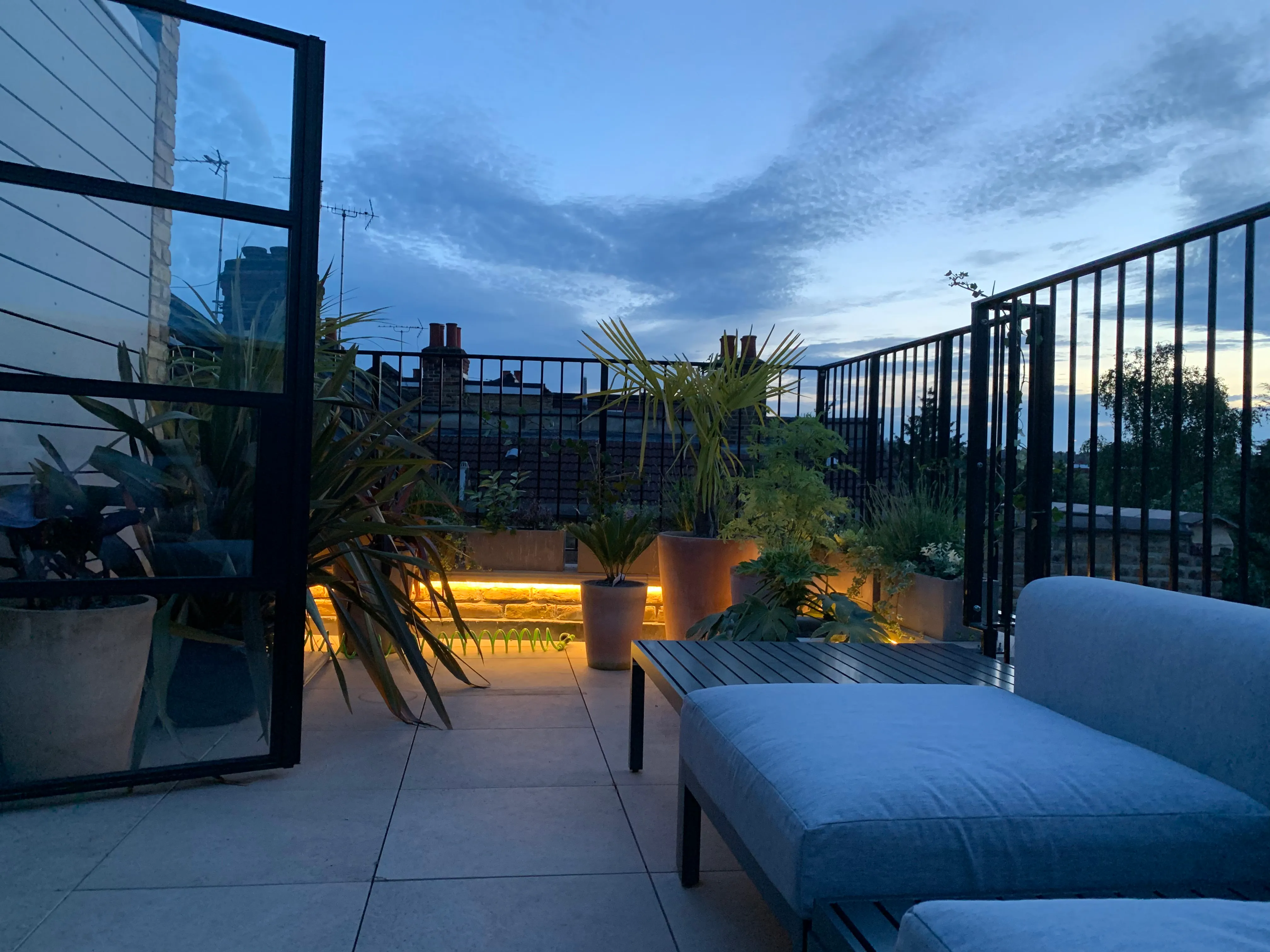 Photo of bathroom with marble walls and gold tap