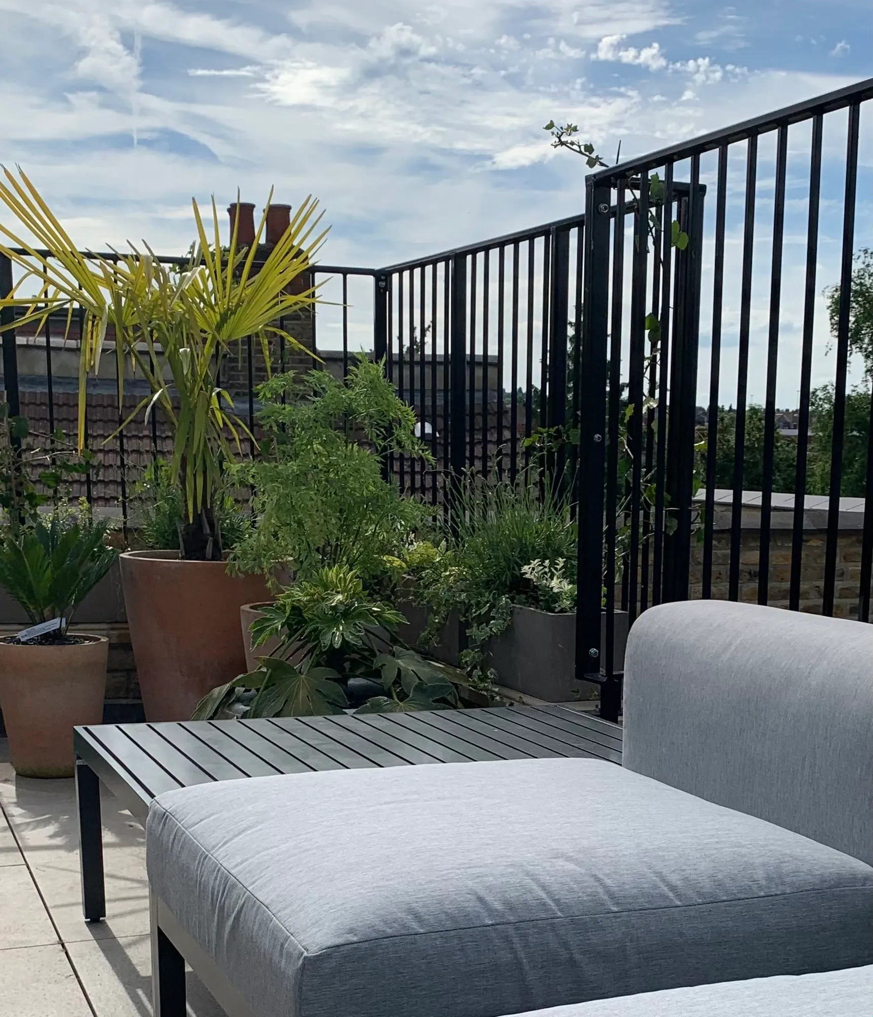 Photo of bathroom with marble walls and gold tap