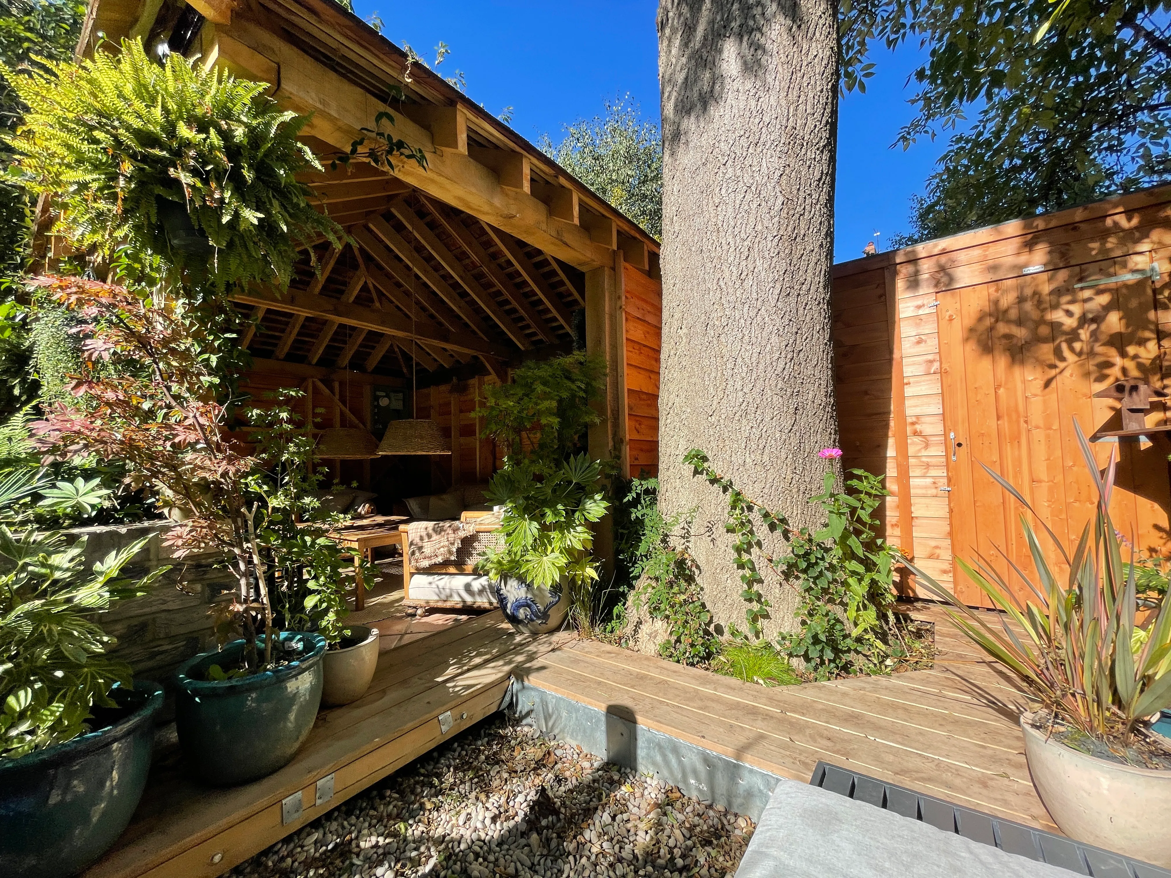 Photo of bathroom with marble walls and gold tap