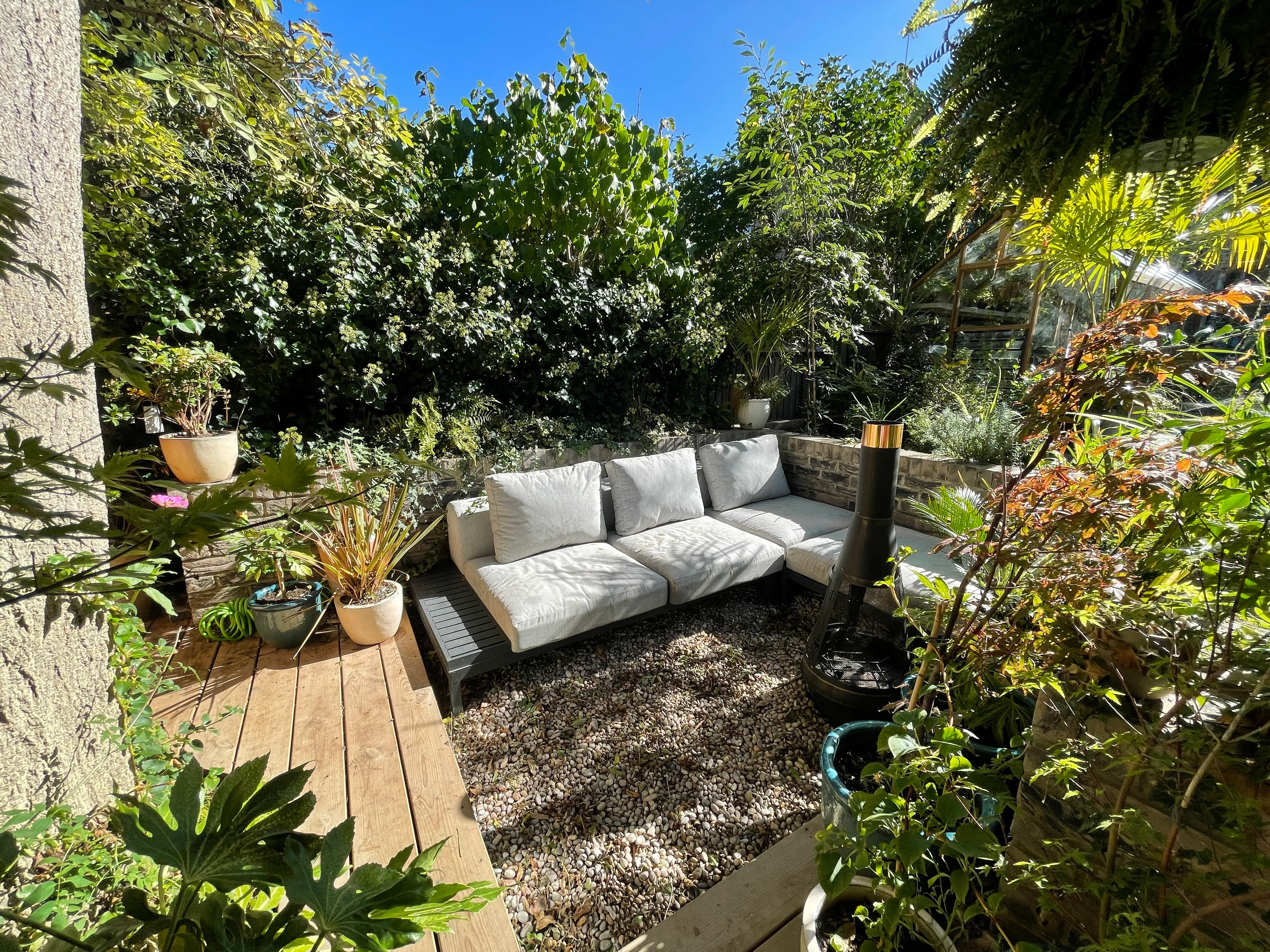 Photo of bathroom with marble walls and gold tap