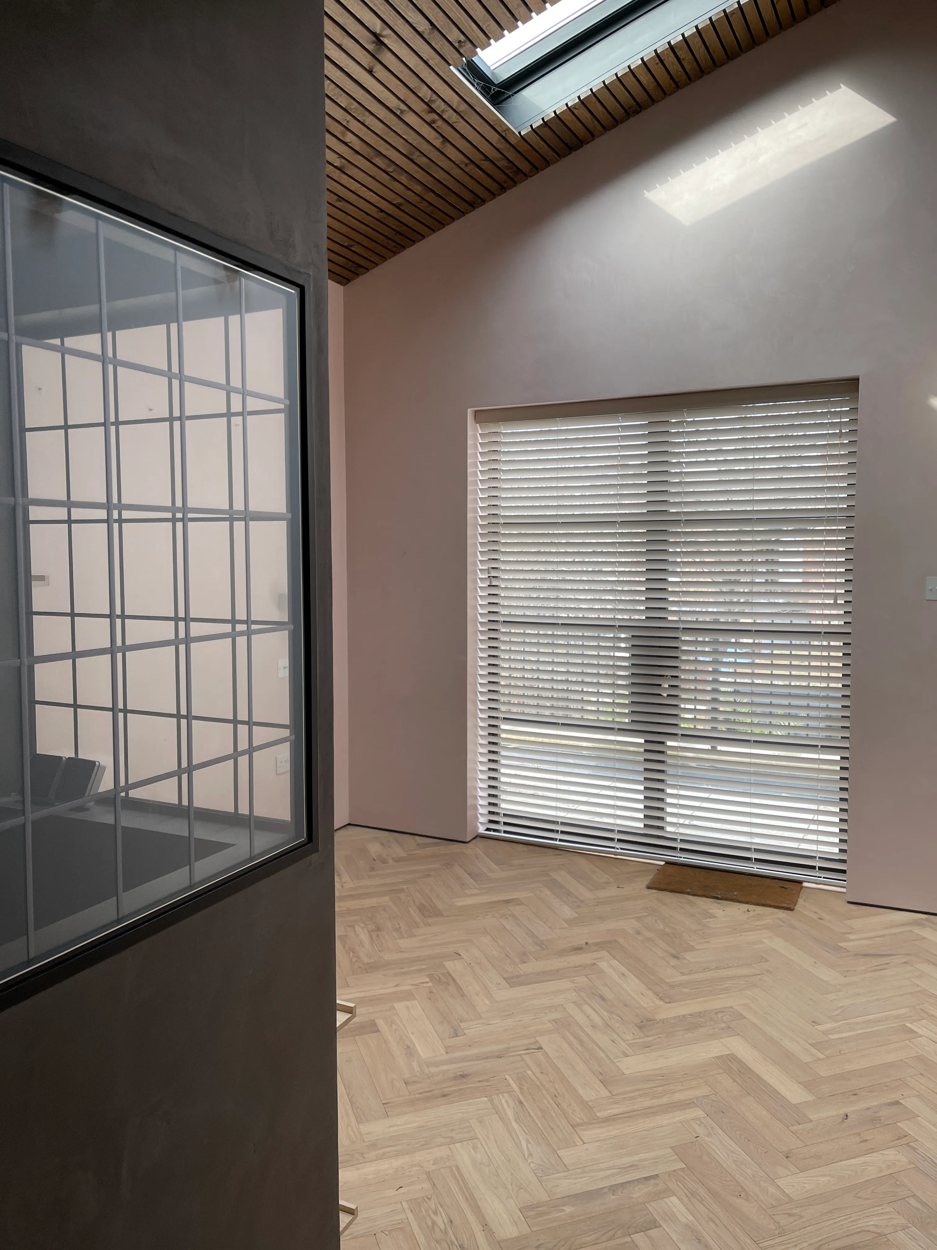 Photo of bathroom with marble walls and gold tap