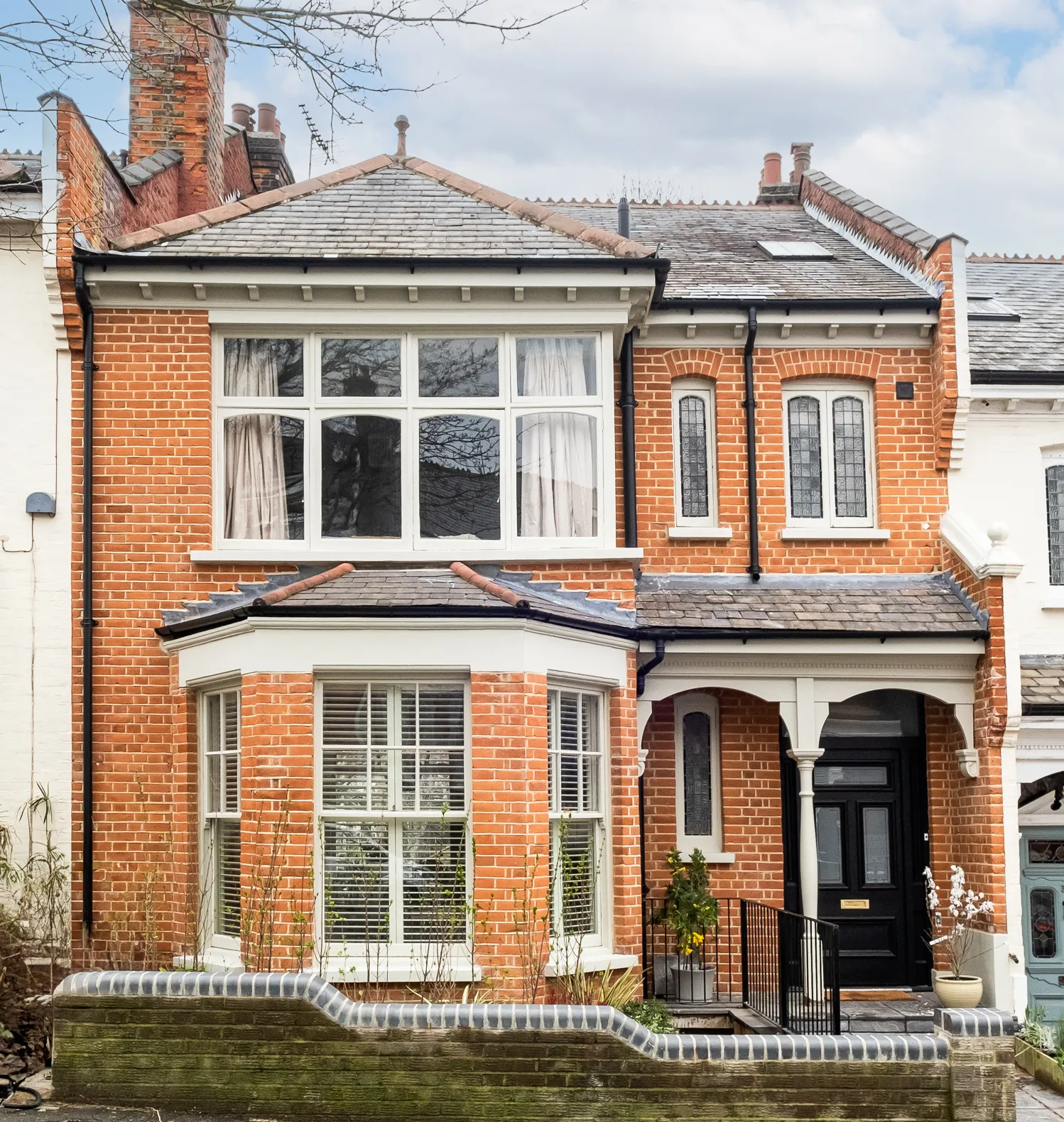 Photo of bathroom with marble walls and gold tap
