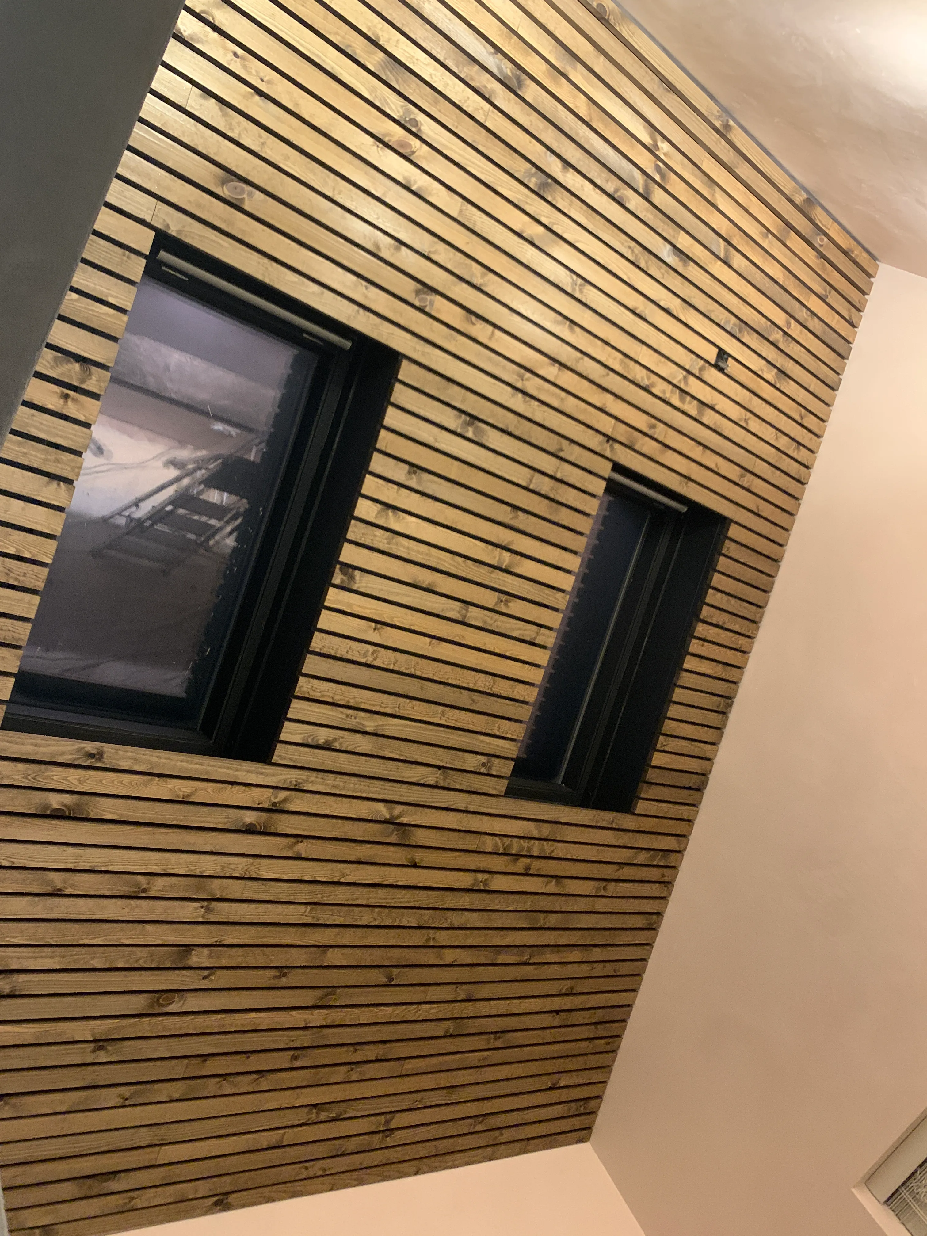 Photo of bathroom with marble walls and gold tap