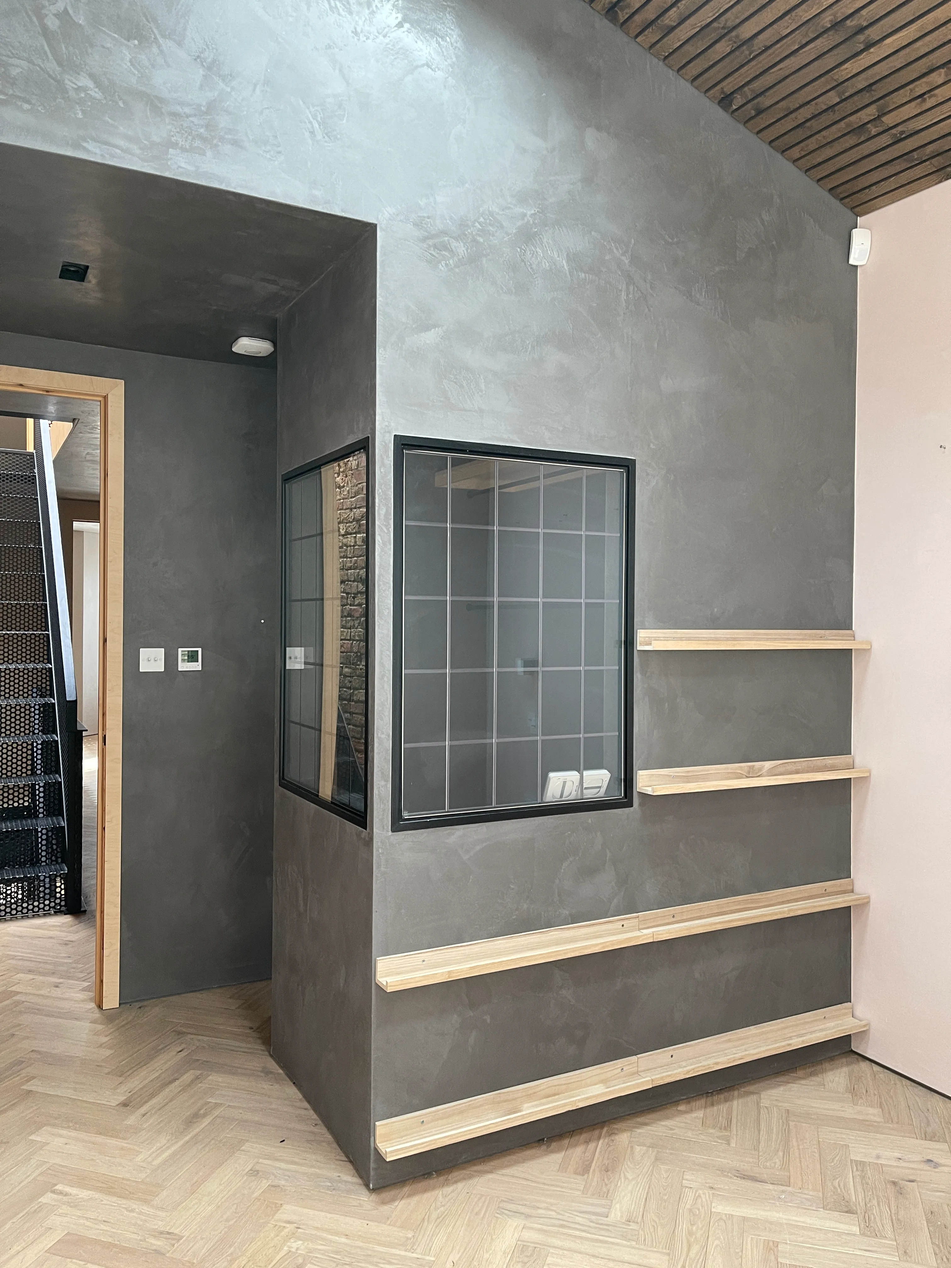 Photo of bathroom with marble walls and gold tap