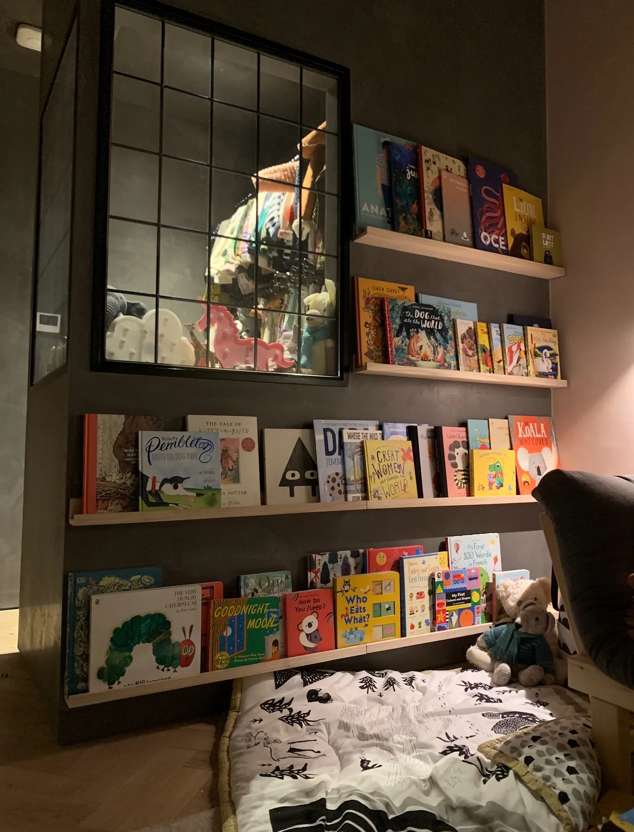Photo of bathroom with marble walls and gold tap