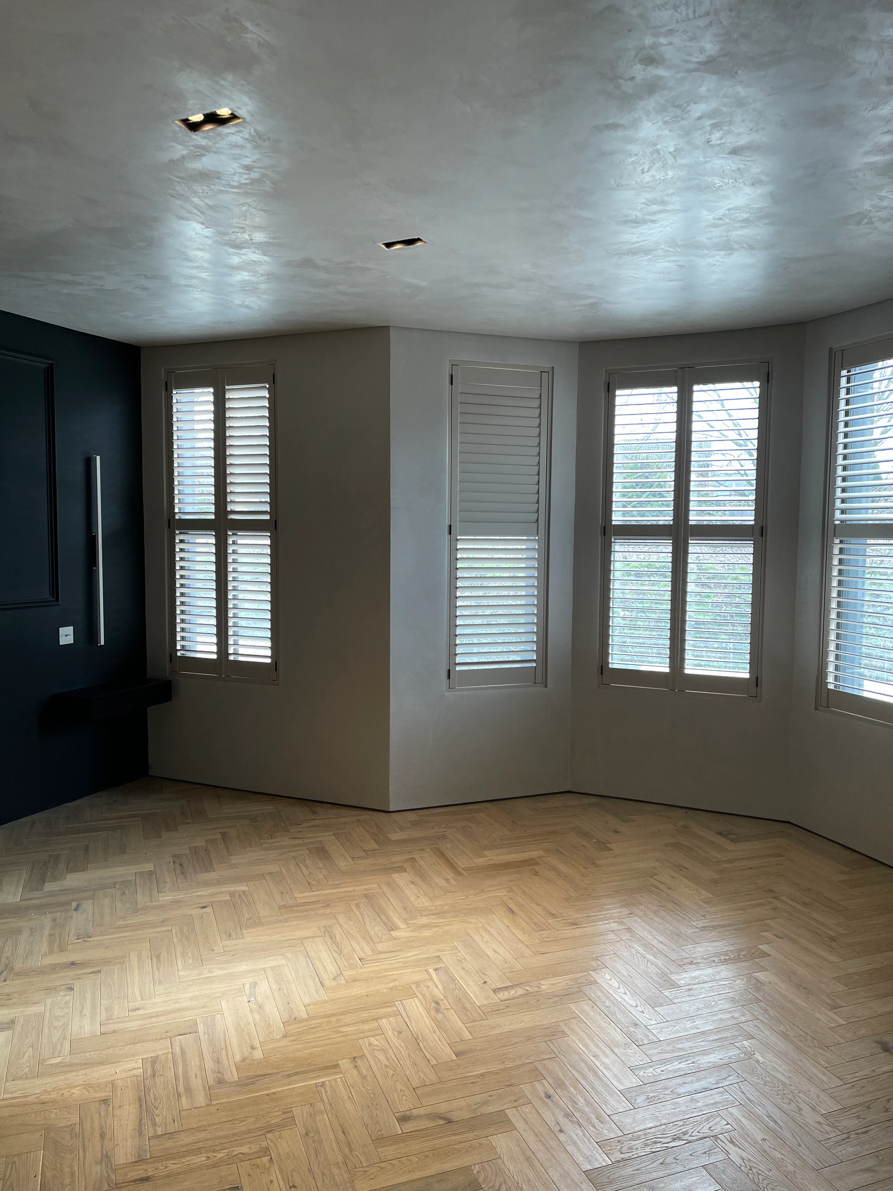 Photo of bathroom with marble walls and gold tap