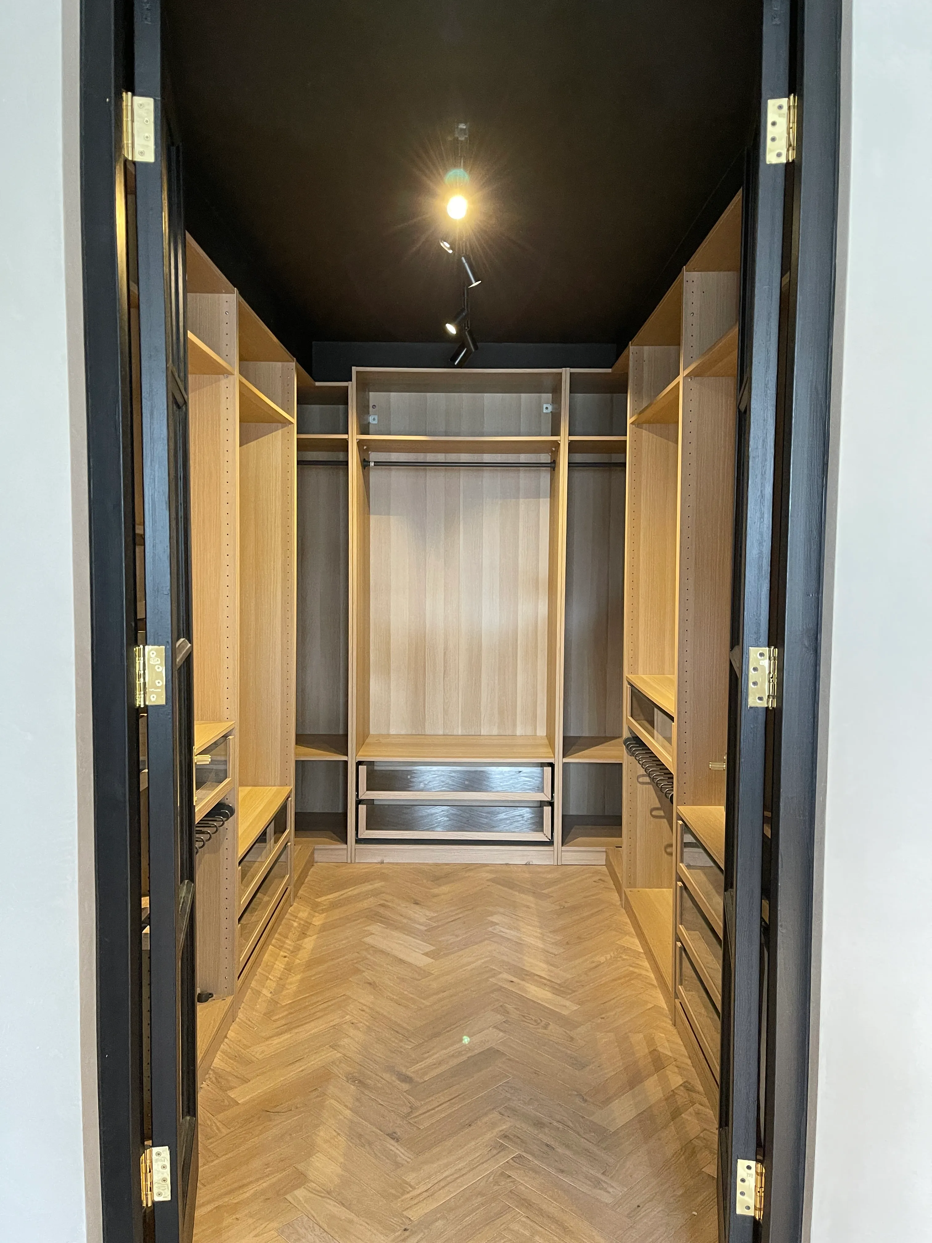 Photo of bathroom with marble walls and gold tap