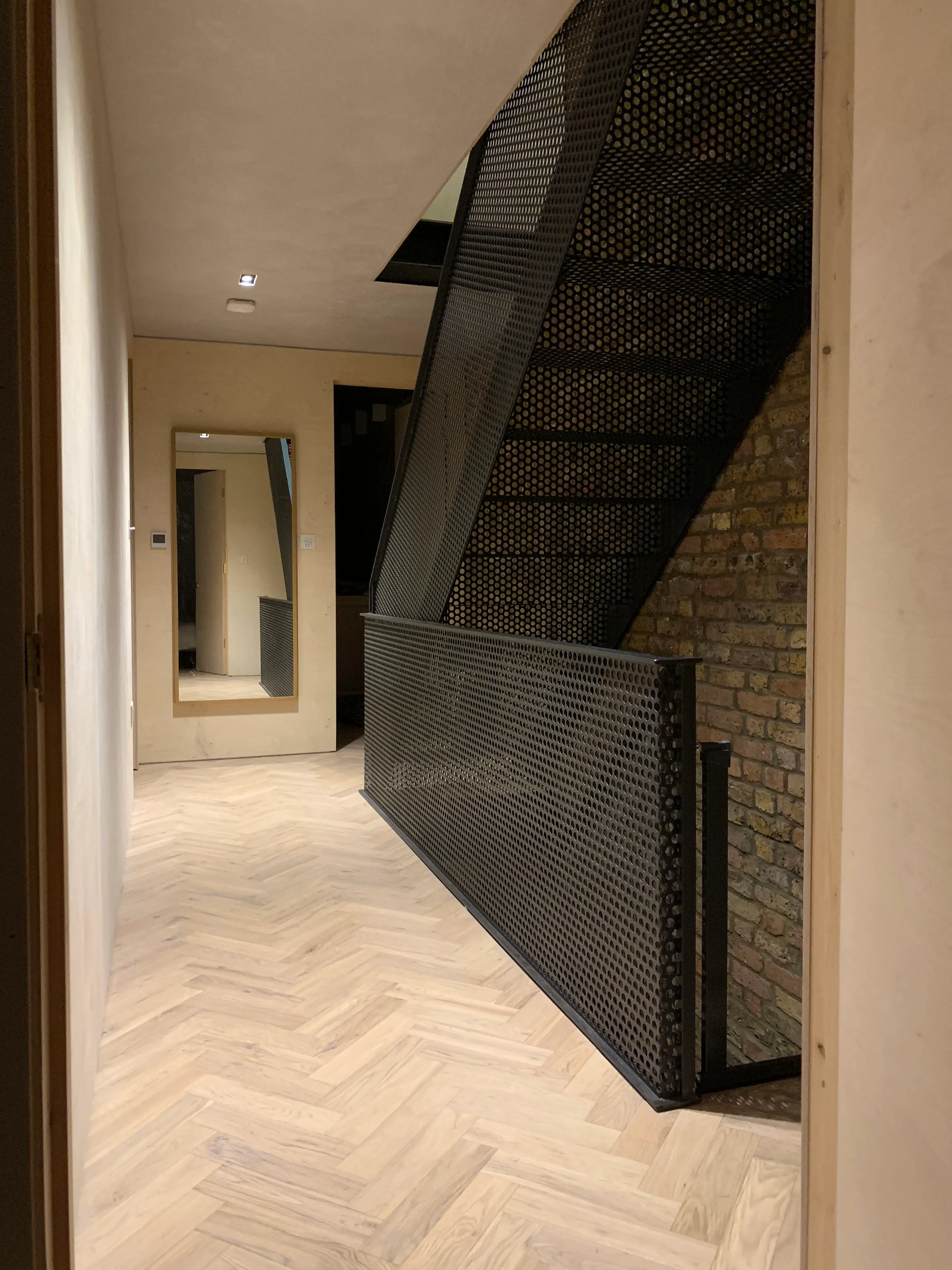 Photo of bathroom with marble walls and gold tap