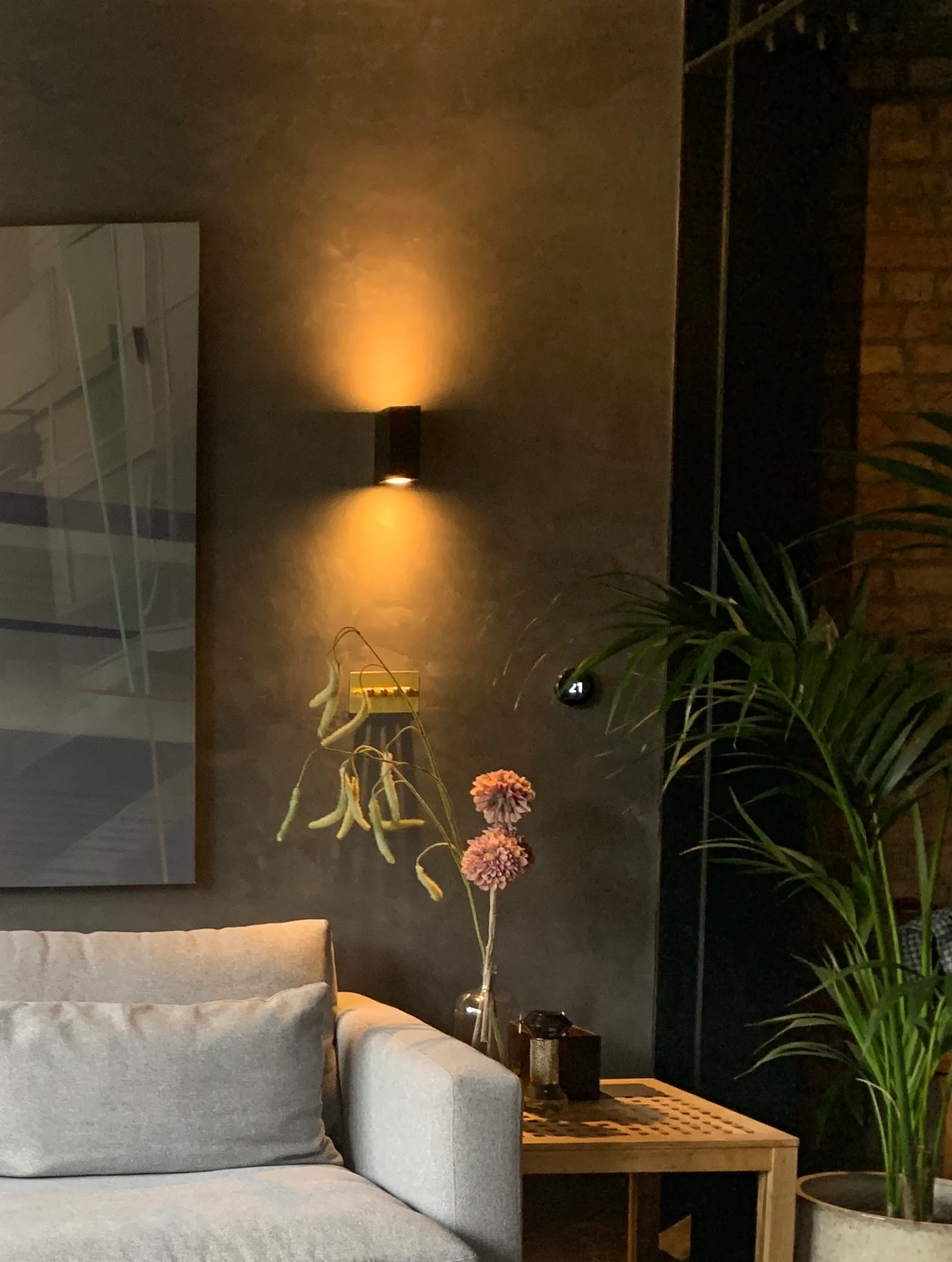 Photo of bathroom with marble walls and gold tap