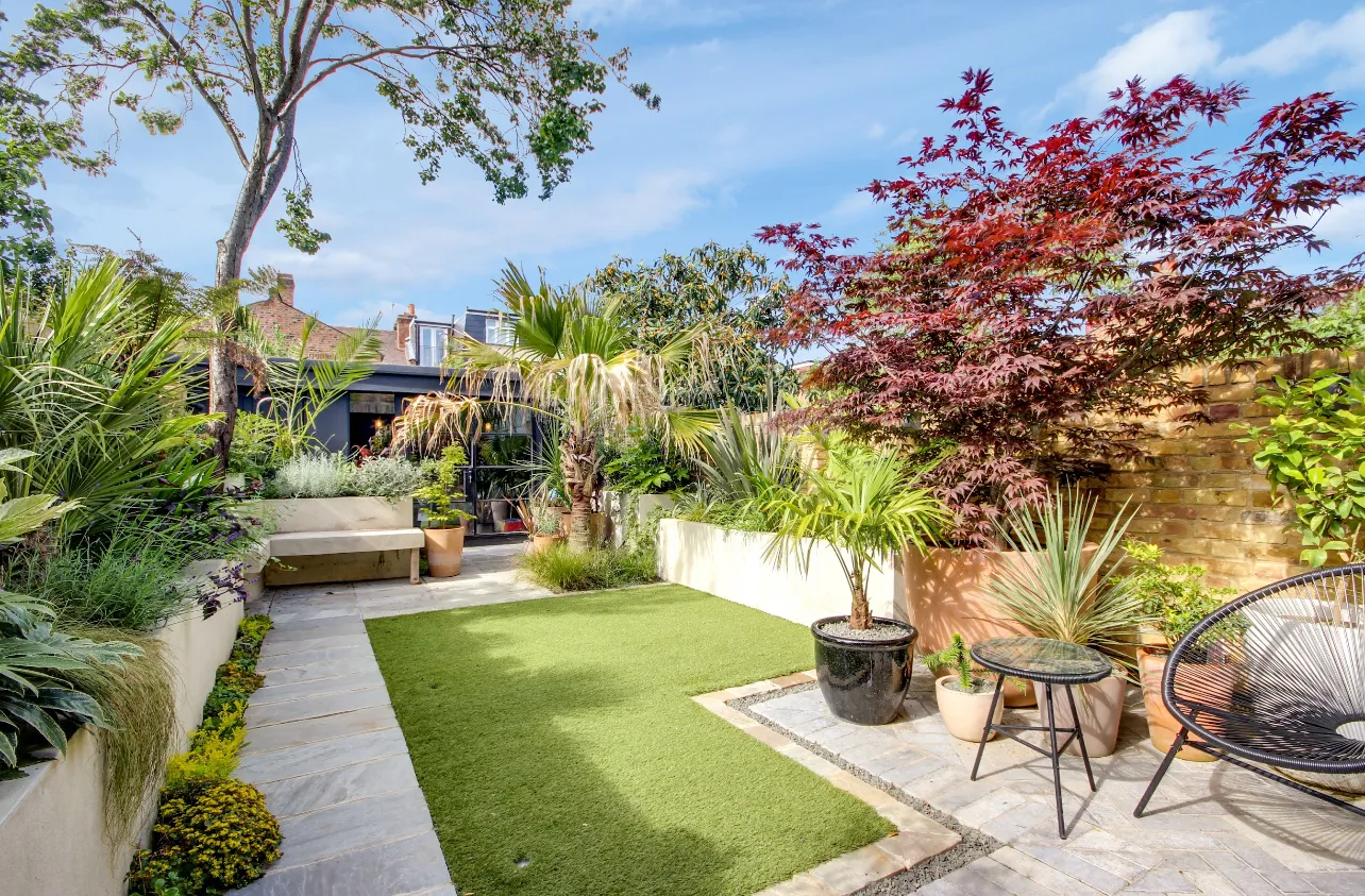 Photo of bathroom with marble walls and gold tap