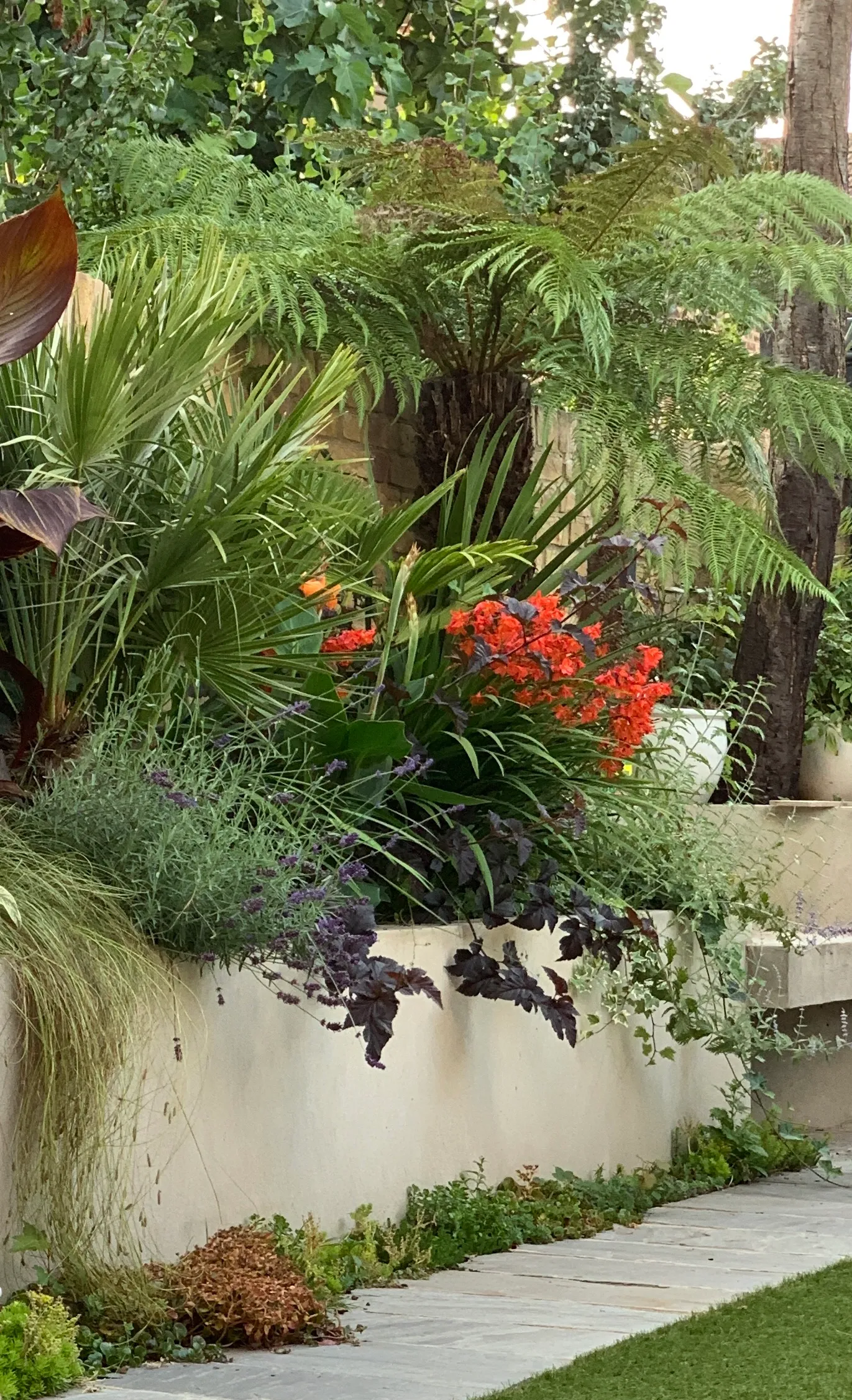 Photo of bathroom with marble walls and gold tap
