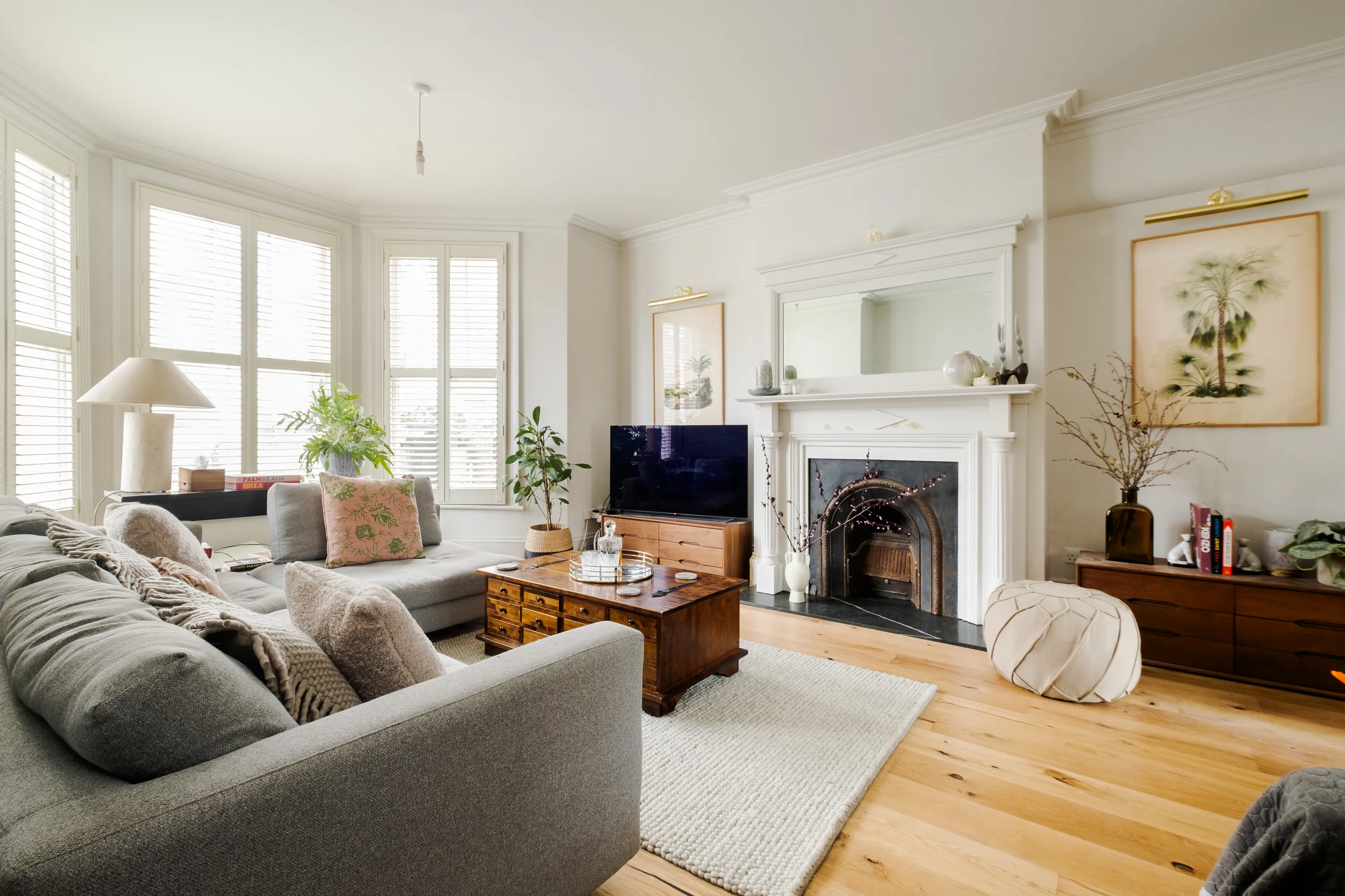 Photo of bathroom with marble walls and gold tap