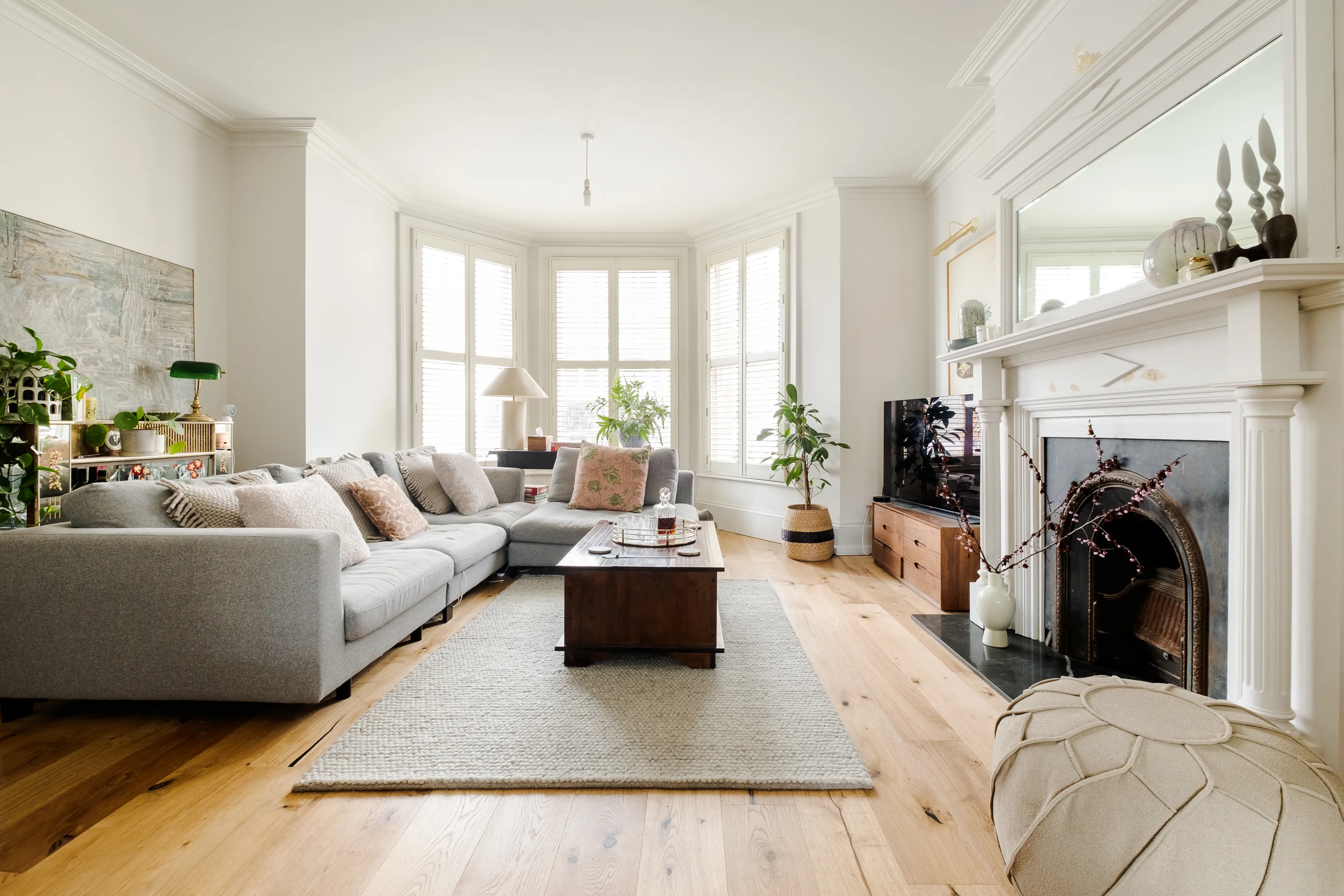 Photo of bathroom with marble walls and gold tap