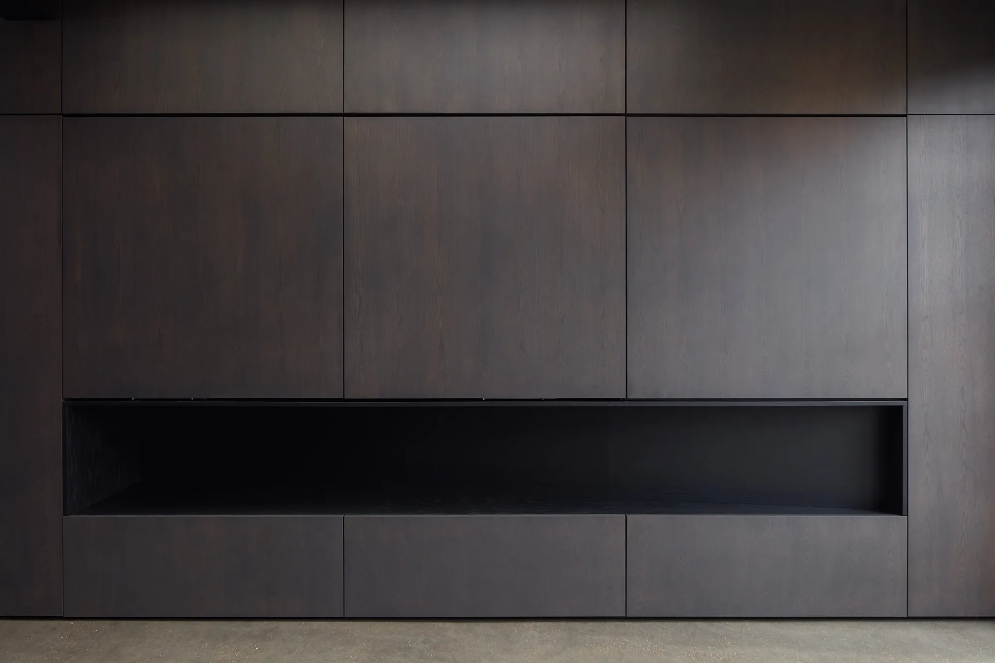 Photo of bathroom with marble walls and gold tap