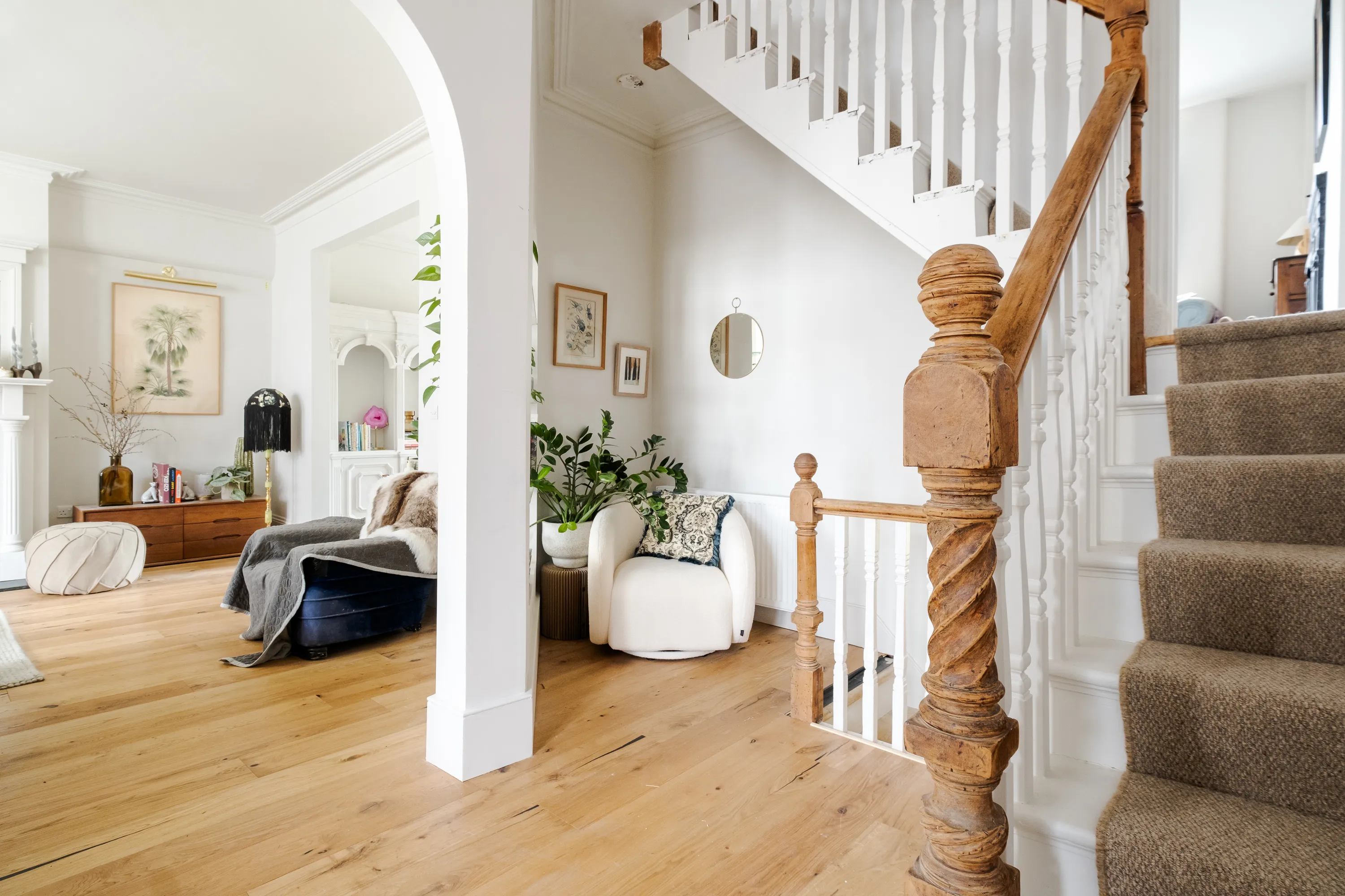 Photo of bathroom with marble walls and gold tap