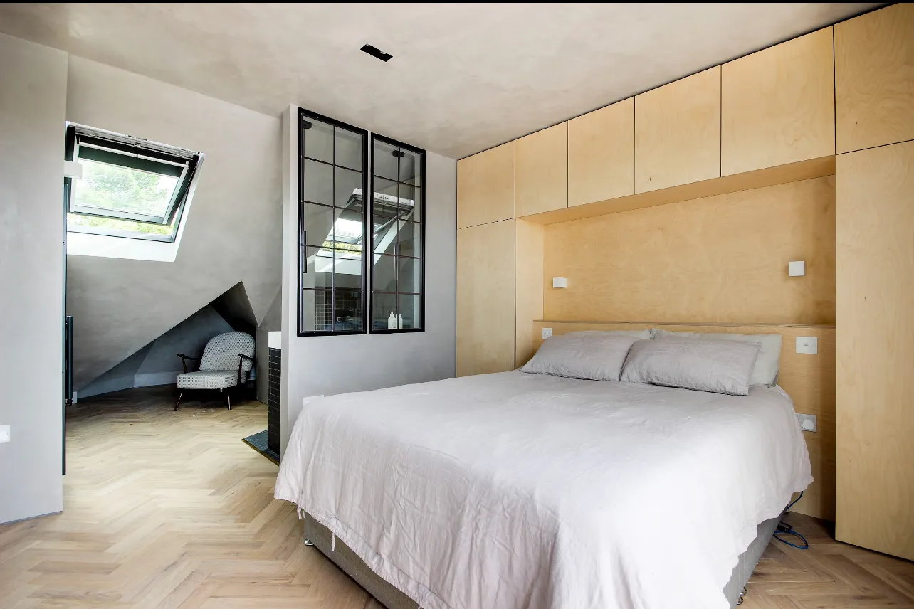 Photo of bathroom with marble walls and gold tap
