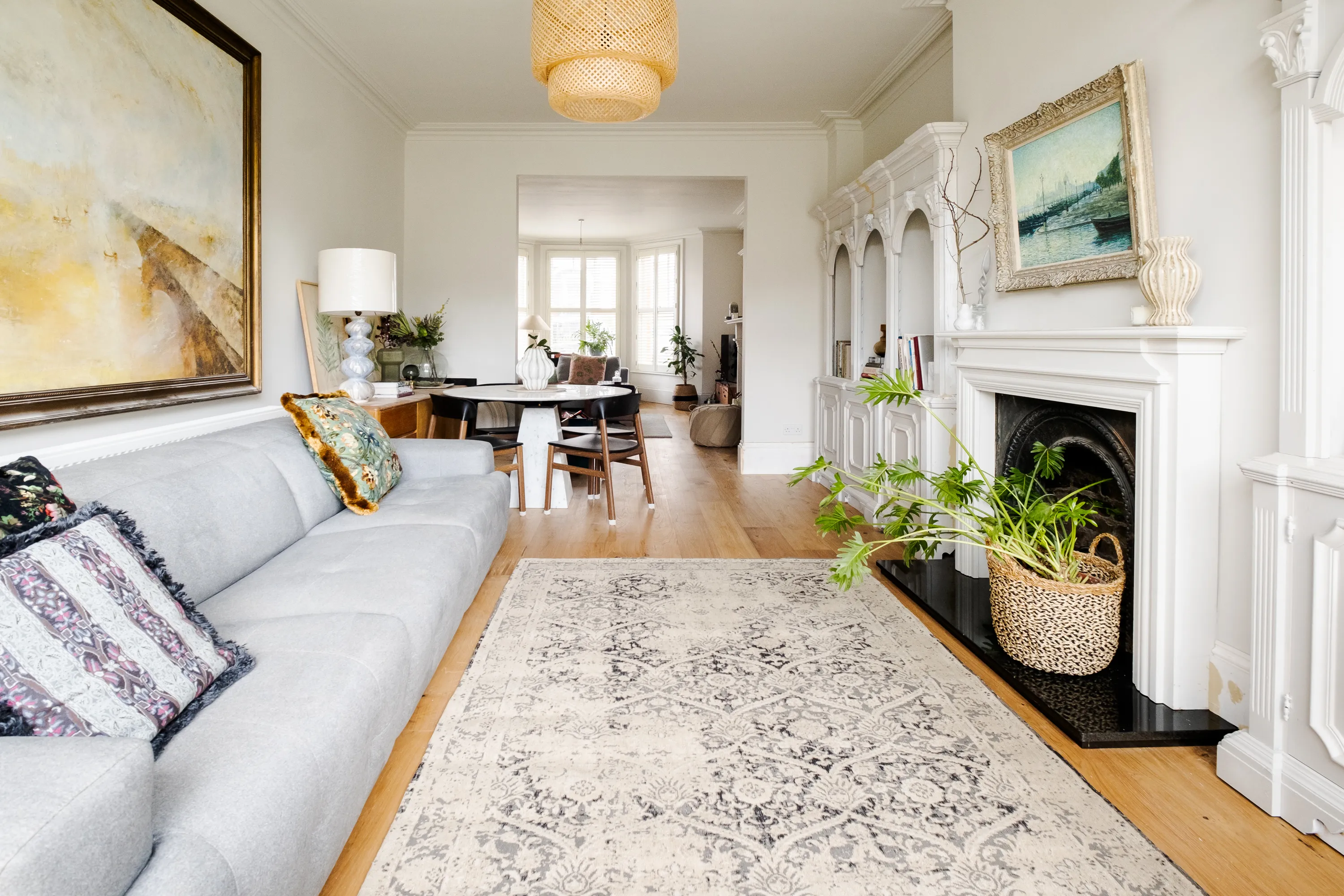 Photo of bathroom with marble walls and gold tap