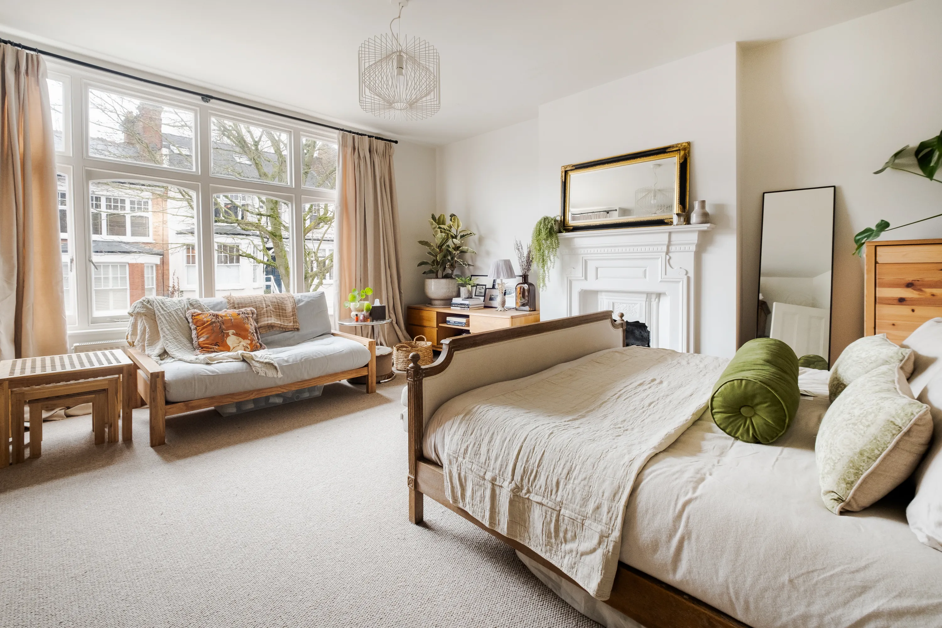 Photo of bathroom with marble walls and gold tap