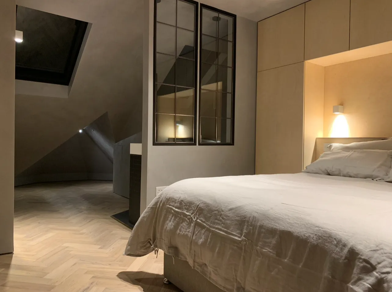 Photo of bathroom with marble walls and gold tap