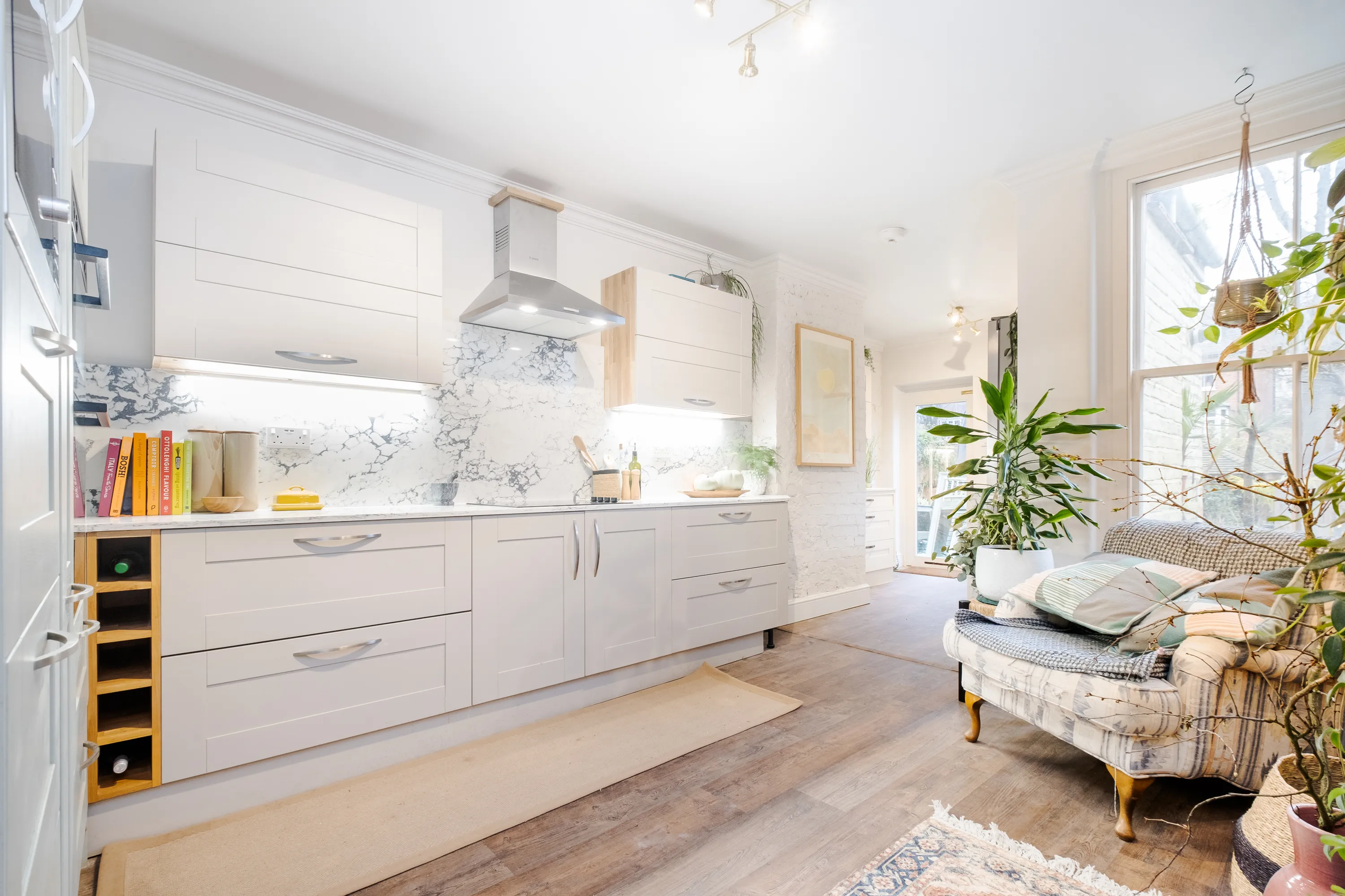 Photo of bathroom with marble walls and gold tap