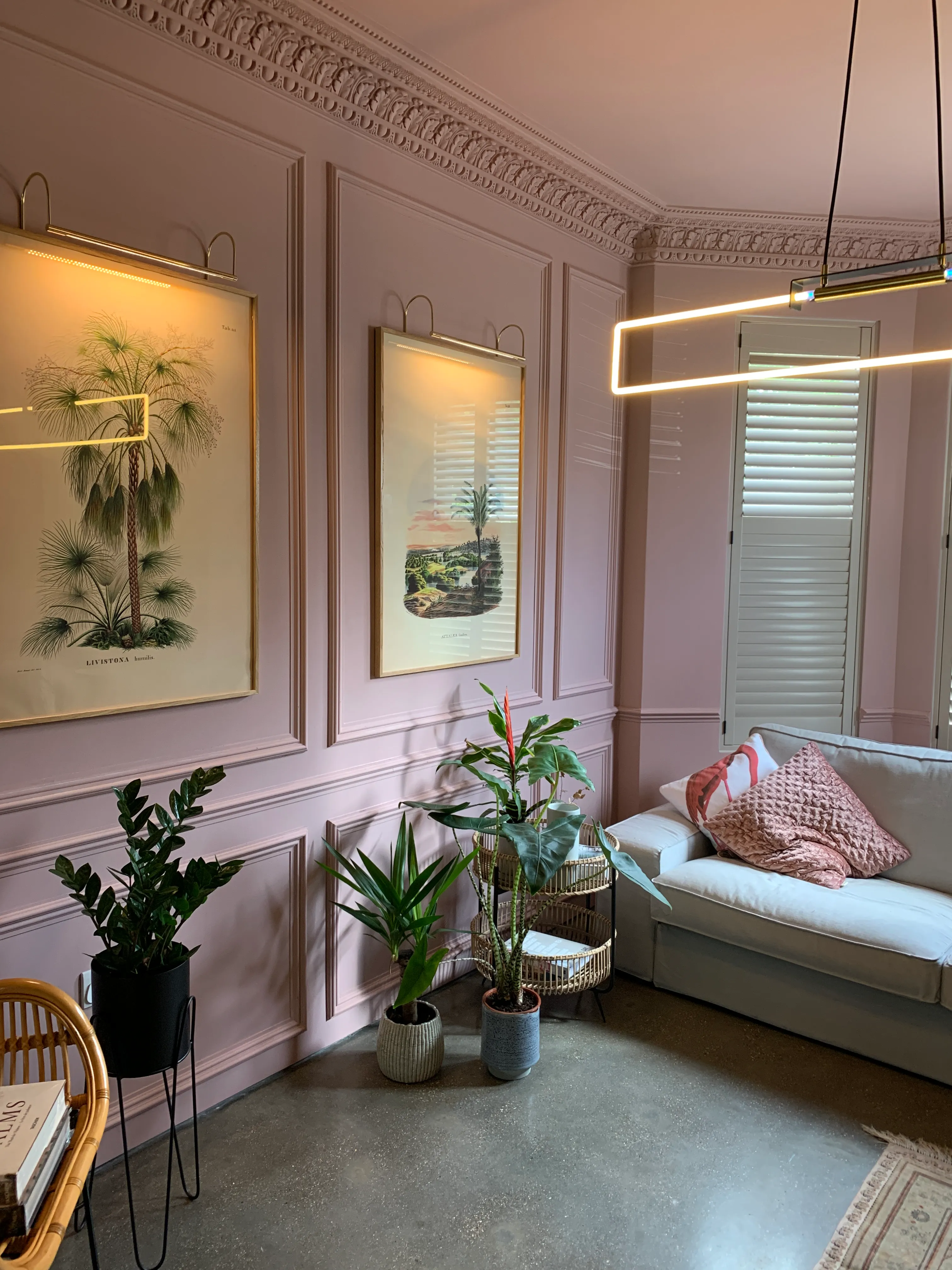 Photo of bathroom with marble walls and gold tap